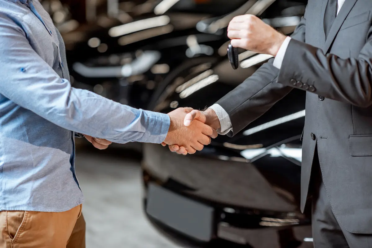 Handshake at the car showroom